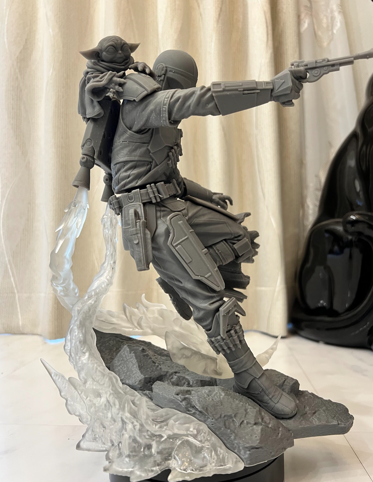 Assembled unpainted resin figure with transparent effect pieces and a scenic base.